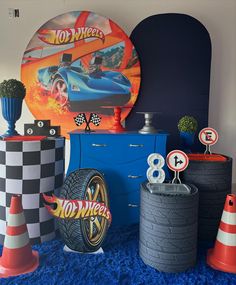 a room filled with lots of different types of toys and decor on top of blue carpeted flooring