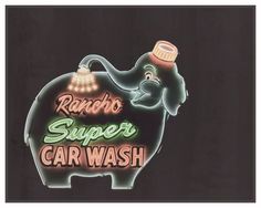 the neon sign for radio super car wash shows an elephant with a hat on it's head