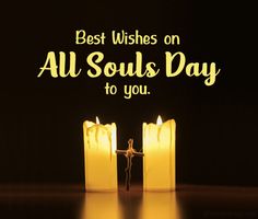 two lit candles with the words best wishes on all soul's day to you