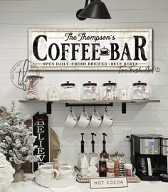 the coffee bar is decorated for christmas with holiday decorations and signs on the wall above it