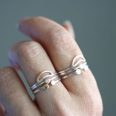 Three of my favorite night sky inspired rings combined for you in this pleasingly curated arrangement. Perfect for the nature girl who wants to make a dainty, subtle set to accompany you everywhere you go. It's also a great for those who get overwhelmed by all of the stacking ring options, and want to simplify the process. This stack is comprised of three separate rings, a Crescent Moon Ring (top), a North Star stacker (middle), and a Beta Lyrae Ring (bottom). Available in sterling silver, or sterling with recycled 14k yellow gold details. All Rebecca Haas Jewelry is handcrafted by me in my Southern Vermont Studio from recycled and ethically sourced materials. Everyday Hand Forged Sterling Silver Stackable Rings, Celestial Sterling Silver Jewelry With Tiny Details, Tiny Celestial Sterling Silver Jewelry, Yellow Gold Sterling Silver Stackable Rings, Hand Forged Nature-inspired Everyday Jewelry, Minimalist Silver Ring In Recycled Gold, Handmade Sterling Silver Stackable Rings In Yellow Gold, Everyday Nature-inspired Sterling Silver Rings, Silver Stackable Rings Made Of Recycled Gold