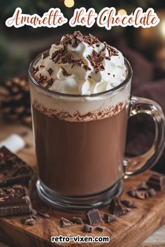 there is a cup of hot chocolate with whipped cream on top and the words, amazing hot chocolate