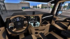 the interior of a truck with dashboard and steering wheel