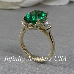 Moissanite Emerald Ring For Anniversary, Green Moissanite Emerald Ring For May Birthstone, Anniversary Emerald Ring With Moissanite Accent Stones, Anniversary Moissanite Emerald Ring With Accent Stones, Moissanite Emerald Ring For May Birthstone, Anniversary Green Emerald Moissanite Ring, Gold Moissanite Emerald Ring For May Birthstone, Green Moissanite Emerald Ring For Anniversary, Trillion Cut Emerald Ring For Anniversary With Prong Setting