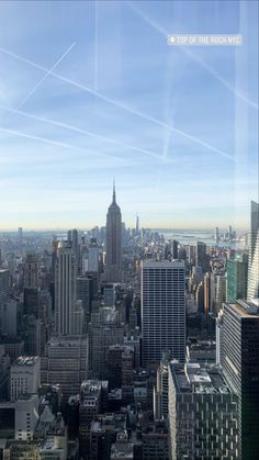 an aerial view of new york city with skyscrapers and the empire building in the foreground