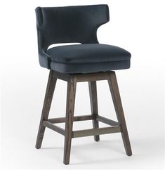 an upholstered bar stool with a dark blue velvet seat and back, viewed from the front