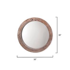 a round mirror sitting on top of a white wall next to a wooden framed mirror