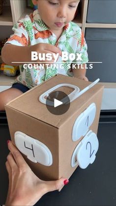 131K views · 7.2K reactions | Looking for a fun and educational activity for your 3+ year-old? This simple DIY game is a total hit!

Using a cardboard box, wipe lids, and Q-tips, your toddler will love learning while playing. 🙌 It’s perfect for:

🧠 Learning numbers, as they count and match Q-tips to the wipe lids.
👋 Boosting fine motor skills, by placing Q-tips into small holes, improving hand-eye coordination.
🎨 Encouraging creativity, and independent play, all while developing important skills!

The best part? You can set it up with items you already have at home! Watch the full video to see how it’s done! ✨ 

#LearningThroughPlay #ToddlerFun #3PlusActivity #ParentHacks #CraftoryKids #ToddlerLearning | Stephanie & Katrina | Crafty Moms Number Games For Toddlers, Orange Splash, Kids Motor Skills, Early Learning Activities, Independent Play, Daycare Ideas, Pre K Activities, Love Learning