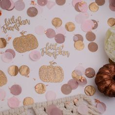 a table topped with lots of confetti and decorations