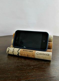 a cell phone sitting on top of two corks