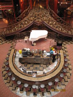 an aerial view of a grand piano in a building