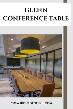 a conference table with chairs and lights in an office setting that is also used as a meeting room