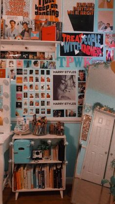 a room filled with lots of books and pictures on the wall next to a dresser