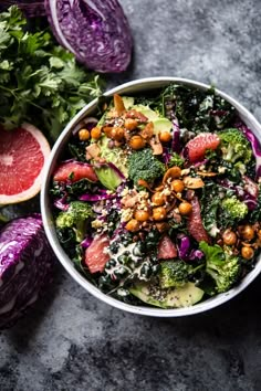 a salad with broccoli, grapefruit, nuts and avocado