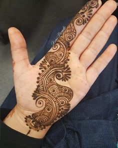 a person's hand with a henna on it