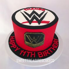 a red and black birthday cake with the wwe logo on it's bottom layer