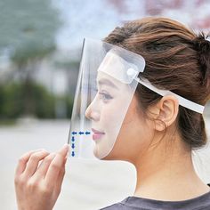 a woman wearing a clear face shield