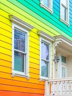 colorful houses with white windows and balconies