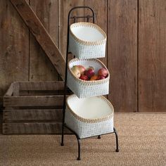 three tiered basket stand with apples in it