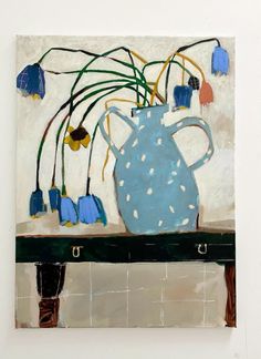 a painting with blue and white flowers in a vase on top of a wooden table