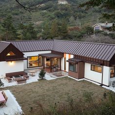 an aerial view of a house in the mountains