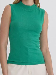 Add a touch of quirkiness to your wardrobe with the LYDIA HIGH NECK SLEEVELESS TOP. Featuring button detail at the shoulder and available in three fun colors, this knit top is perfect for those who don't take themselves too seriously. Style with your favorite jeans for a unique and fun outfit. 100% Nylon See size chart in photos. Spring Turtleneck Stretch Tank Top, Spring Stretch Turtleneck Tank Top, Stretch Turtleneck Tank Top For Spring, Trendy Turtleneck Tank Top For Summer, Stretch Cotton Sweater Vest For Spring, Casual Turtleneck Tank Top For Spring, Stretch Crew Neck Tank Top For Fall, Fitted Green Top With Ribbed Neckline, Fitted Crew Neck Tank Top For Spring