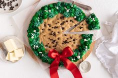 a cake decorated with green frosting and chocolate chips