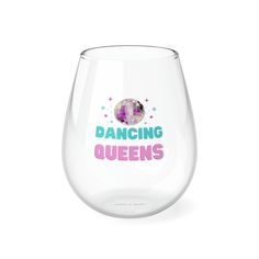 a wine glass with the words dancing queens printed in pink, blue and purple on it