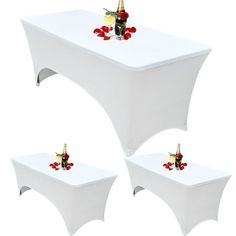 three white tables with red roses on them and two champagne bottles in each tablecloth