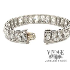 This sparkling vintage, circa 1900's, Edwardian diamond link bracelet is masterfully crafted in platinum. The bracelet contains ten large center diamonds, the center of which is an Old Mine Cut (OMC), flanked by the other nine larger Old European Cut (OEC) diamonds. The center OMC diamond is approx 1.35 carats and is an H color VS1 clarity. The two larger of the flanking diamonds are approximately 3/4 carats each, while the remaining 7 larger diamonds are approximately 1/4 carat each. Finally, e Formal Diamond-cut Link Bracelet, Silver Art Deco Diamond Bracelet With Brilliant Cut, Luxury Vintage Diamond Cut Bracelet, Art Deco Platinum Diamond Bracelet, Art Deco Platinum Diamond Cut Bracelet, Art Deco Diamond, Link Bracelets, Silver Bracelet, Diamond Cuts