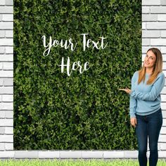 a woman standing in front of a green wall with the words your text here on it