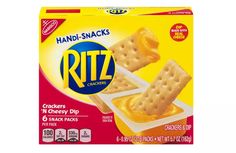 a box of ritz crackers with cheese dip on top and crackers in the middle