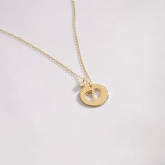 "Our 14k Solid Gold Baby Footprint necklace has been designed with a mother's warm touch in mind. The high-quality dainty diamond necklace that'll keep the memory of motherhood alive. The perfect gift for a perfect mom on Mother's day or a birthday. F E A T U R E S * Made to Order. * Gold KT: 14K * Choice of Gold Color: Yellow Gold, Rose Gold, White Gold * Gem Stone: Genuine Diamond * Diamond-Cut: Round * Diamond Carat: 0.01 ct * Pendant Height: 12 mm / 0.47 inch * Pendant Width: 12 mm / 0.47 in Dainty 14k Gold Keepsake Jewelry, Hypoallergenic Yellow Gold Jewelry For Birthday, Personalized 14k Gold Jewelry For Keepsake, Personalized 14k Gold Keepsake Jewelry, Minimalist 14k Gold Keepsake Jewelry, White Gold Necklace Stamped 14k For Keepsake, 14k Gold Stamped Charm Necklace For Mother's Day, Birthday Yellow Gold Sterling Silver Charm Necklace, Yellow Gold Birthstone Jewelry For Keepsake