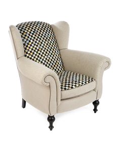 an upholstered chair with black and white checkered cushions