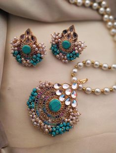 Color            torques  Material       Stones, pearls  Style.           Trending long necklace  Pakistani and Indian jewelry, long necklace, mala set  called gajra set. Very beautiful and elegant. Pakistani Bridal Jewelry, Bollywood Jewelry, India Jewelry, Pakistani Jewelry, Pakistani Bridal, Indian Jewelry, Long Necklace, Antique Jewelry, Bridal Jewelry