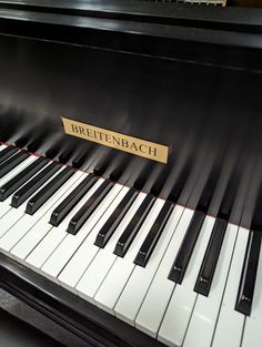 a close up of a piano with the words breiten bach on it's side