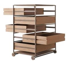 an industrial shelving unit with drawers and wheels