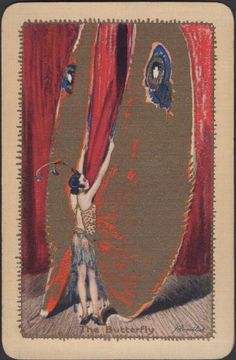 a woman standing in front of a red curtain with her hands on the curtains,