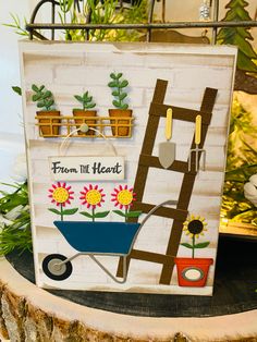 a handmade card with flowers and a ladder on it that says from the heart