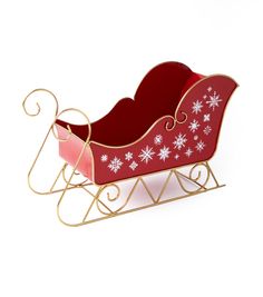 a red sleigh with white snowflakes on it