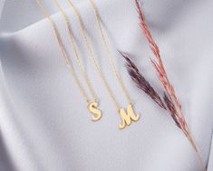 To give a dainty meaningful gift for your loved one you can prefer this 14K real gold custom letter necklace . Or this solid gold personalized initial pendant can be special treat just for yourself . You can prefer any  initial on this family initial charm . This  exclusive bridesmaid jewelry is made to order . *FEATURES We are using real gold in our product for letter pendant and chain .  Material : 14 K Solid Gold  Colour : white gold ,  yellow gold or rose gold upon your reqest  Chain Length : 12''-20'' upon your request  The open necklace laid straight & measured end to end. * PACKAGING Jewels will be sent nicely wrapped and packed in a box! If specific goods are intended as gifts, please leave us a note. We'll use a special box separately and include a gift card for you! The most uniq Personalized 14k Gold Initial Necklace For Mother's Day, Gold Initials Name Necklace For Mom, Gold Initials Name Necklace As Gift For Mom, Personalized Yellow Gold Initial Necklace For Mother's Day, Yellow Gold Initials Necklace Gift For Mom, 14k Gold Initial Pendant Name Necklace For Her, 14k Gold Initial Pendant Necklace - Gift For Her, Yellow Gold Monogram Name Necklace For Mother's Day, Monogrammed Yellow Gold Name Necklace For Mother's Day