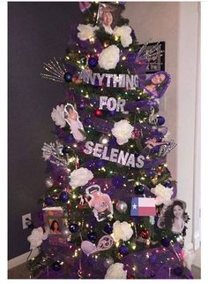 a purple christmas tree with pictures on it