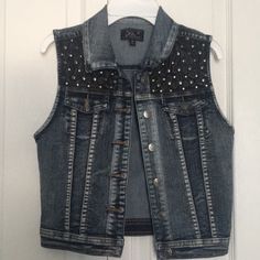 Blue Denim Studded Stretchy Vest. Never Used. Size M Trendy Fitted Blue Denim Vest, Trendy Stretch Blue Denim Vest, Trendy Blue Stretch Denim Vest, Blue Stretch Denim Vest, Blue Stretch Denim Jacket, Trendy Stretch Denim Vest In Medium Wash, Trendy Medium Wash Stretch Denim Vest, Trendy Dark Wash Denim Vest, Edgy Denim Vest For Spring