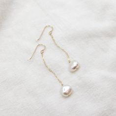 Length: 2" Materials: Freshwater Pearl, 14k Gold Filled Holiday Processing Time: 3 Weeks Handmade by Amanda Michelle Freshwater Pearls are natural and no two are exactly alike. The pearls that I select for your earrings will be the same size and similar in shape. Best Seller, 3 Weeks, Freshwater Pearls, Gold Filled, Oregon, Wedding Day, Wonder, Sterling Silver, Silver