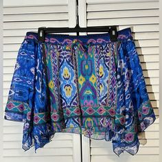 Colorful Flowy Ultra Light Polyester, This Little Thing Has An Equally Light Liner That Keeps Everything But Your Gorgeous Legs Concealed. It’s Made By Zara In Morocco, And Has A Lively Traditional Motif In The Print. Asymmetrical Hem Keeps The Skirt Moving With You. Nwt Size L Measurements Approximate 17” Waist 14” Waist To Hem Blue Stretch Summer Skirt, Casual Blue Bottoms With Vibrant Print, Flowy Blue Skirt For The Beach, Casual Blue Flowy Skirt, Casual Flowy Blue Skirt, Flowy Blue Bottoms For Day Out, Blue Boho Print Beach Skirt, Bohemian Blue Zara Bottoms, Casual Skirt With Vibrant Print For Vacation