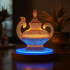 a lit up teapot sitting on top of a wooden table