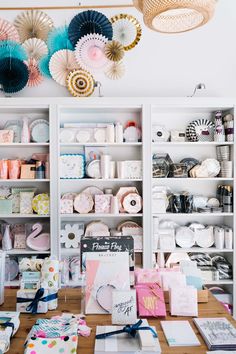 a room filled with lots of different types of paper and crafting supplies on shelves