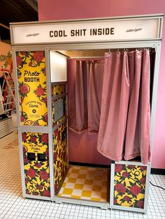 an old fashion clothing store display with pink and yellow curtains