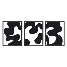 three black and white paintings hanging on the wall in front of a white background, each with an abstract design