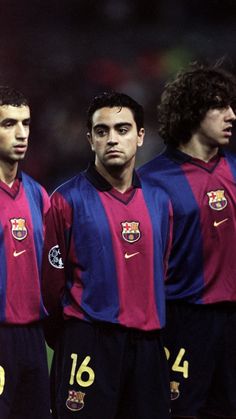 three soccer players standing next to each other in uniforms with numbers on their chests